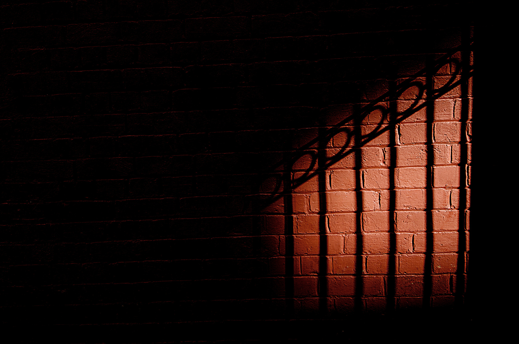 Shadows on Red Brick Wall